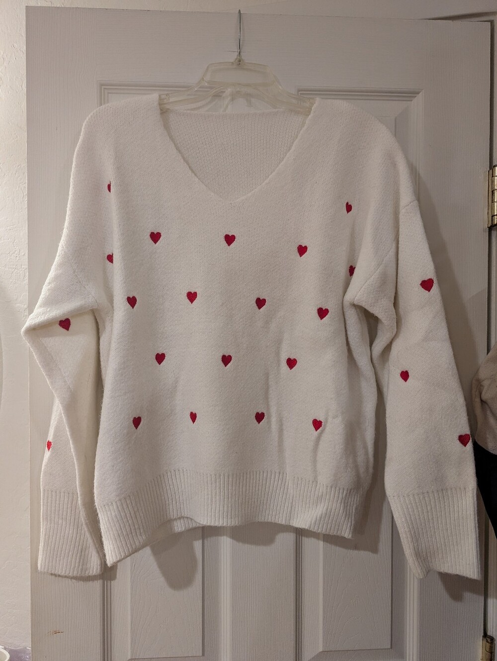 Cozy White V-Neck Sweater with Pink Heart Details